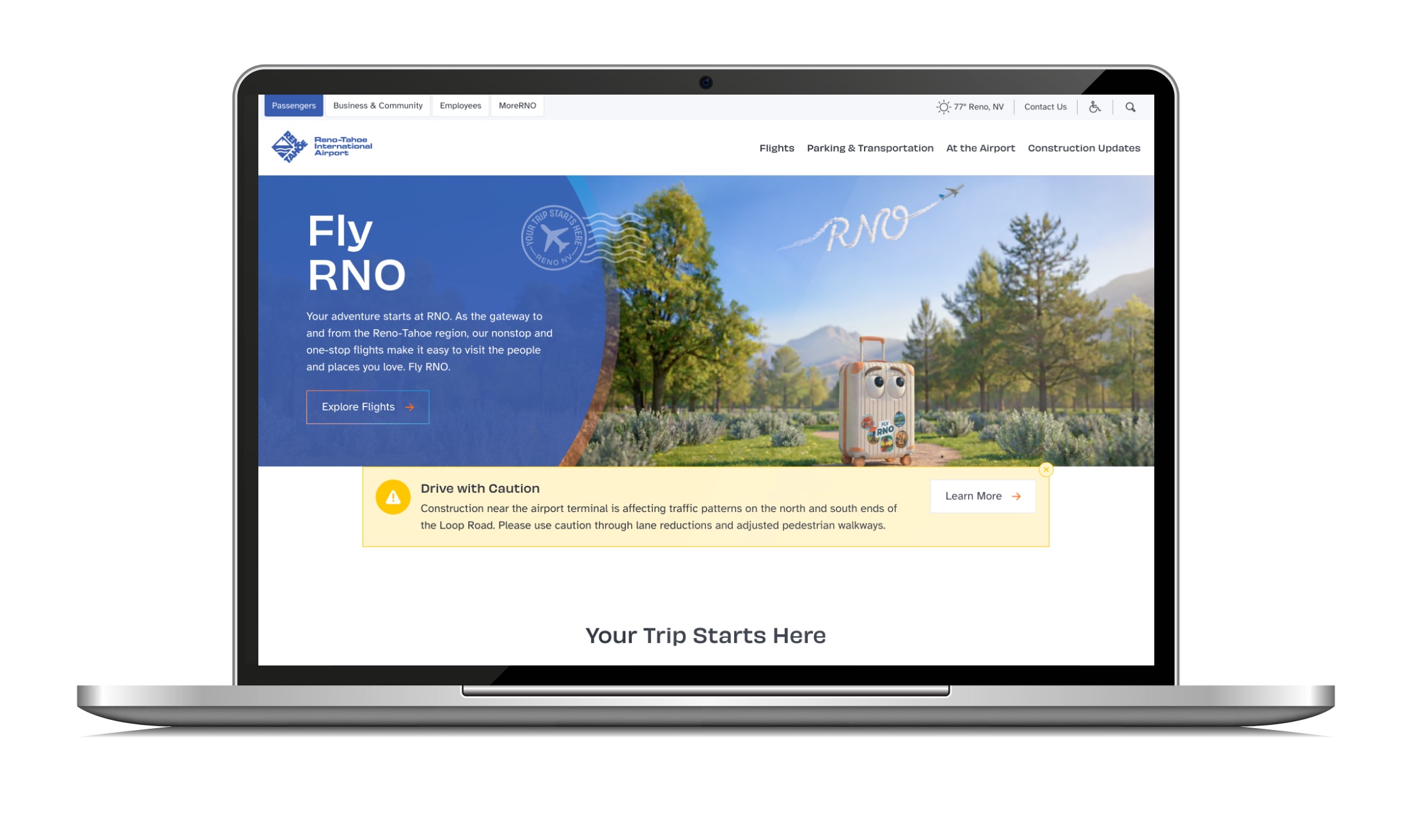 Laptop showing an airport homepage, with a large headline beside an illustrated suitcase on a mountain trail